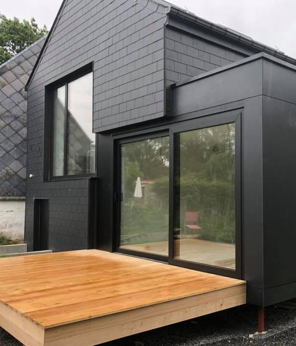 Terrasse en bois et maison en bardages